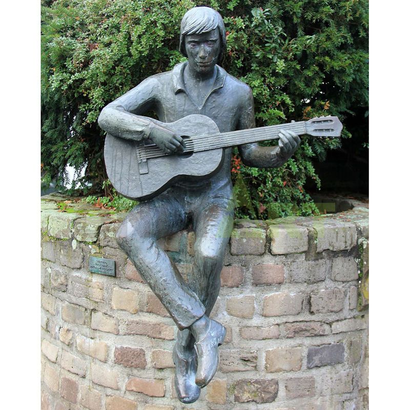 Bronze sculpture of singer with short hair